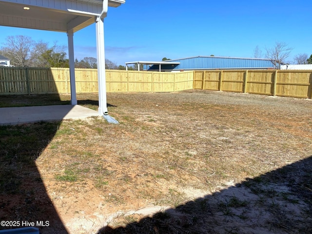 view of yard with a fenced backyard