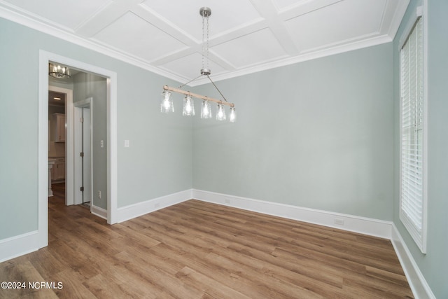 unfurnished dining area with coffered ceiling, hardwood / wood-style floors, and an inviting chandelier