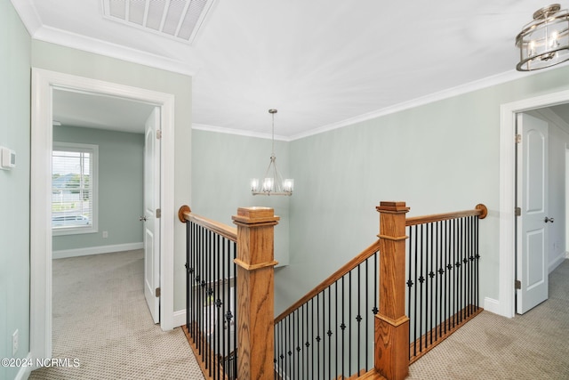 corridor with light carpet, crown molding, and a notable chandelier