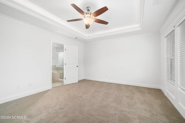 unfurnished bedroom with light colored carpet, ceiling fan, ornamental molding, and ensuite bathroom