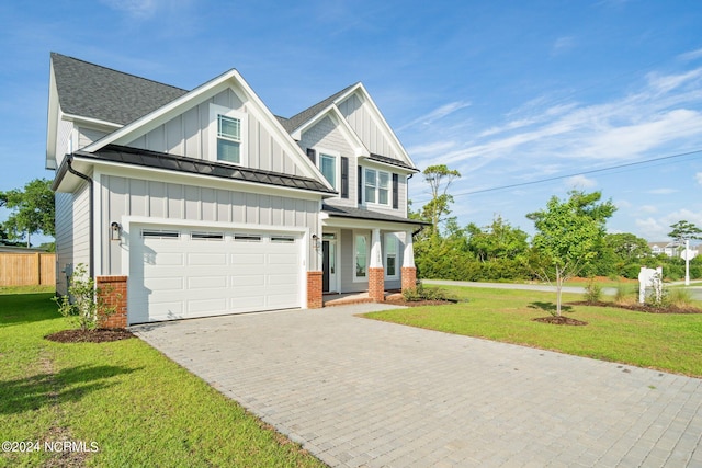 craftsman inspired home featuring a front yard, a garage, and a porch