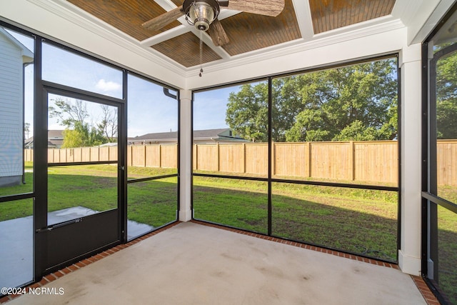 unfurnished sunroom featuring a wealth of natural light and ceiling fan