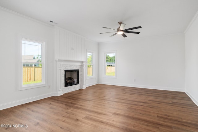 unfurnished living room with ornamental molding, hardwood / wood-style floors, and ceiling fan