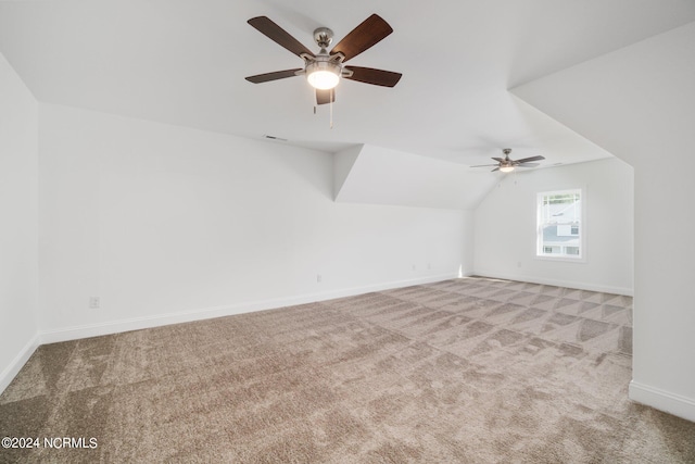 bonus room with light carpet, ceiling fan, and vaulted ceiling