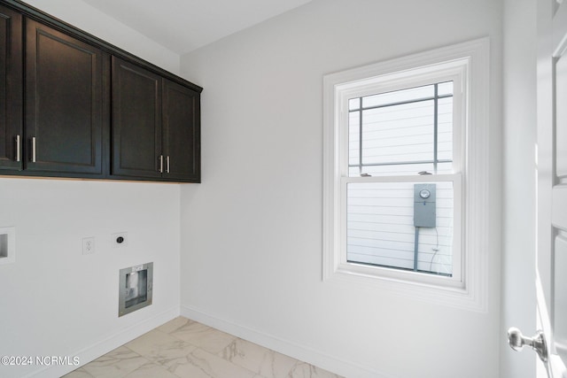 clothes washing area with cabinets, hookup for a washing machine, and electric dryer hookup