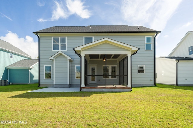 back of property featuring a patio area, a yard, a sunroom, cooling unit, and ceiling fan