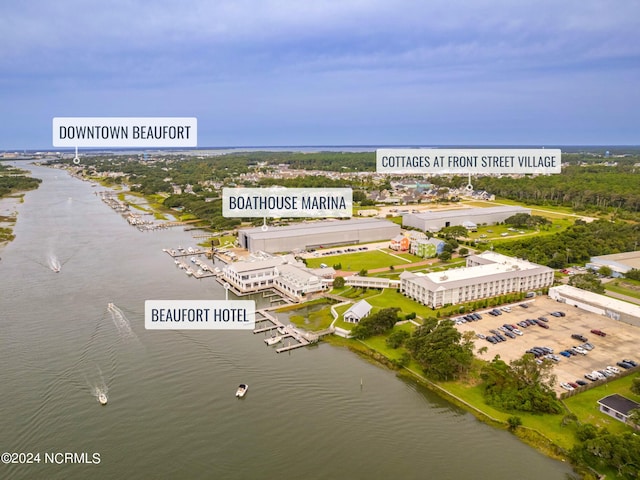 birds eye view of property featuring a water view