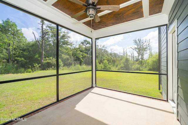 unfurnished sunroom featuring wooden ceiling and ceiling fan