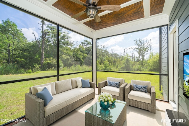 sunroom featuring wood ceiling and ceiling fan