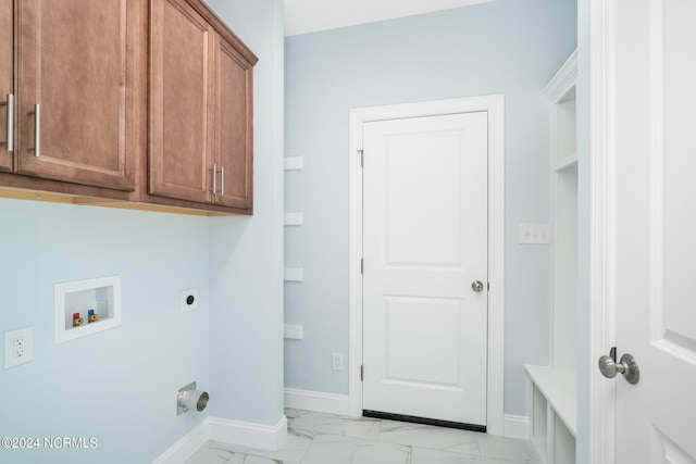 clothes washing area with marble finish floor, hookup for a washing machine, cabinet space, electric dryer hookup, and baseboards