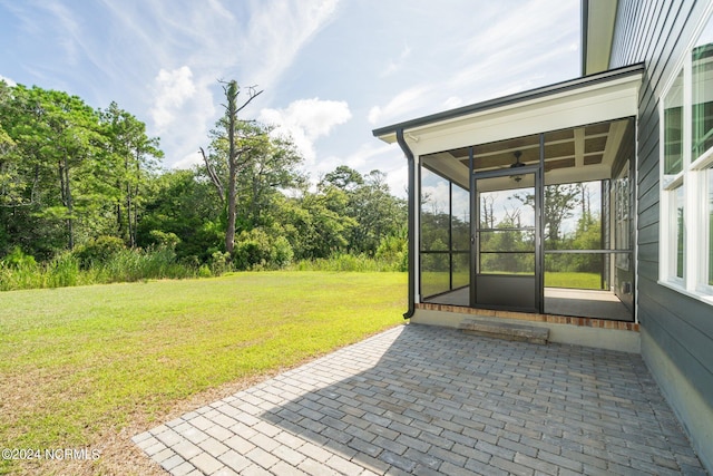 view of patio with a sunroom