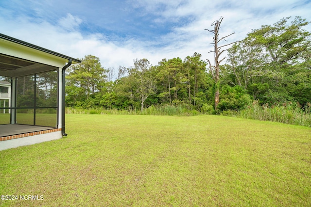 view of yard featuring a sunroom