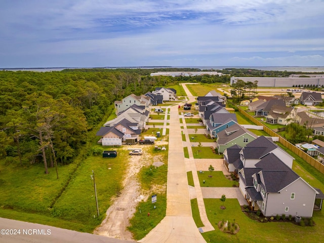 bird's eye view featuring a forest view and a residential view