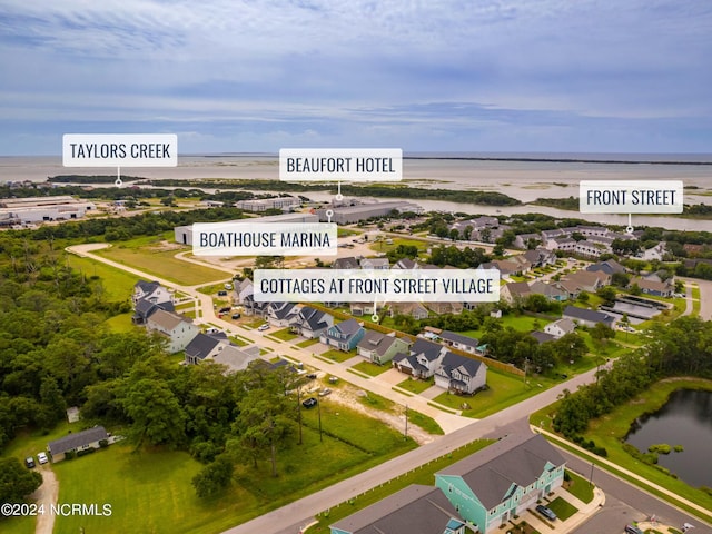 aerial view with a water view and a residential view