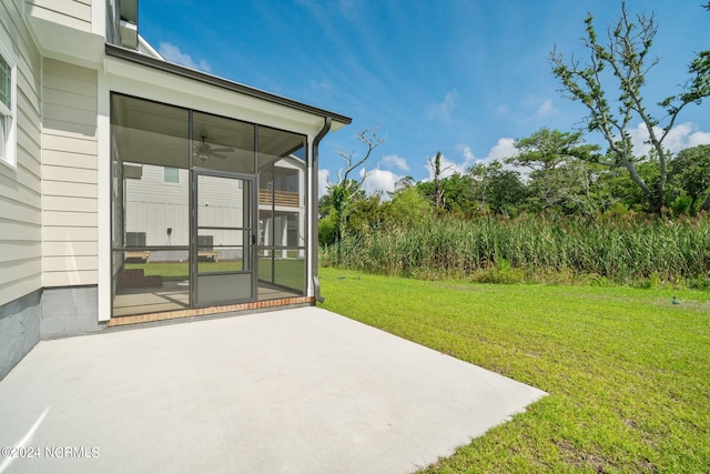 view of yard featuring a patio and a sunroom