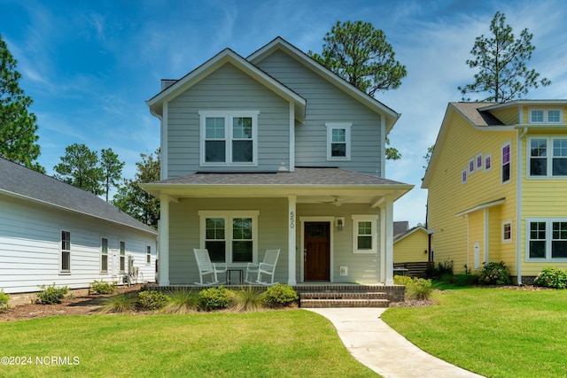 view of front of home featuring a porch and a front lawn