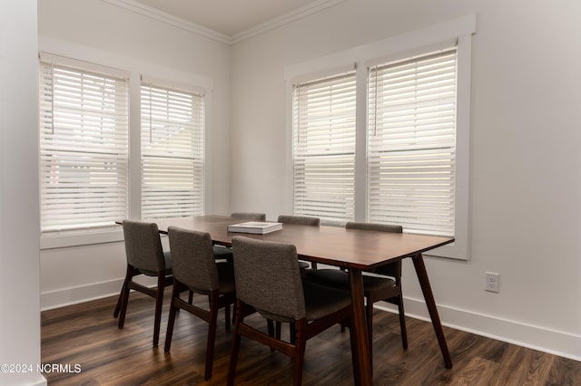 dining room featuring crown molding and dark hardwood / wood-style flooring