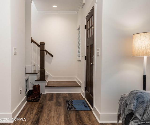 hall featuring hardwood / wood-style flooring and crown molding