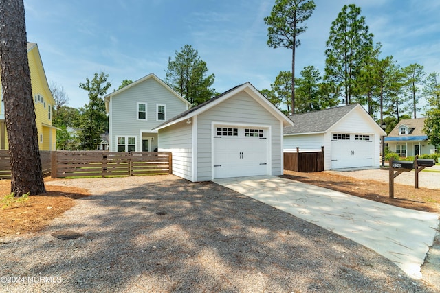 view of front facade featuring an outbuilding and a garage