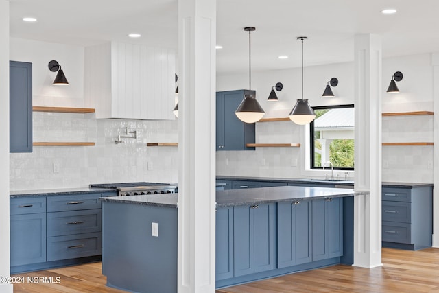 kitchen featuring backsplash and light hardwood / wood-style flooring