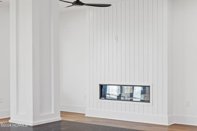 interior details with hardwood / wood-style floors and ceiling fan