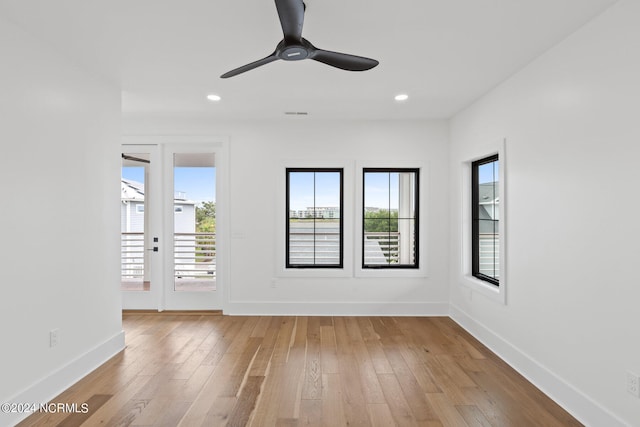 unfurnished room with french doors, ceiling fan, and light hardwood / wood-style floors