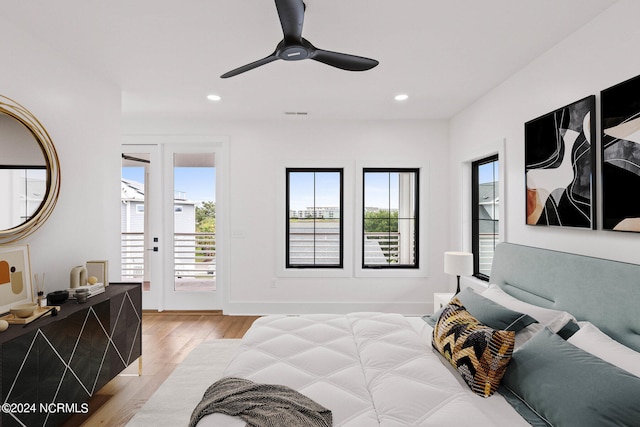 bedroom with ceiling fan, access to outside, french doors, and light hardwood / wood-style flooring