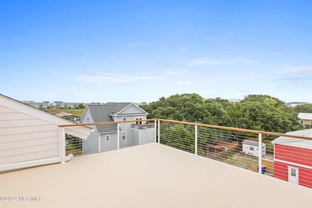 view of patio featuring a balcony