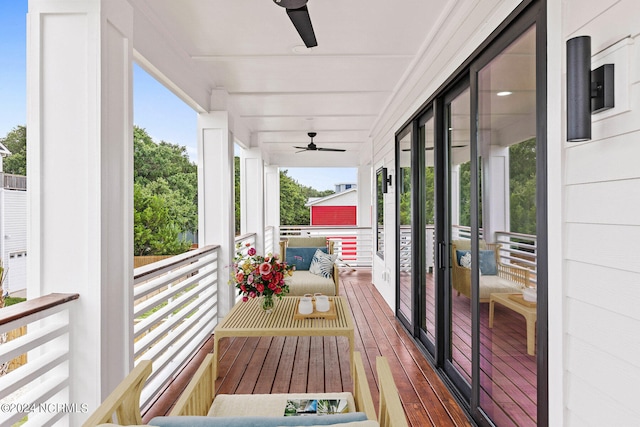 wooden terrace featuring ceiling fan