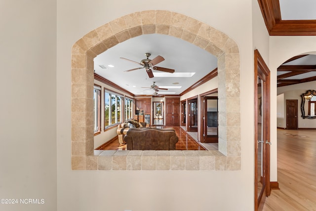 kitchen with light hardwood / wood-style floors, crown molding, french doors, and ceiling fan