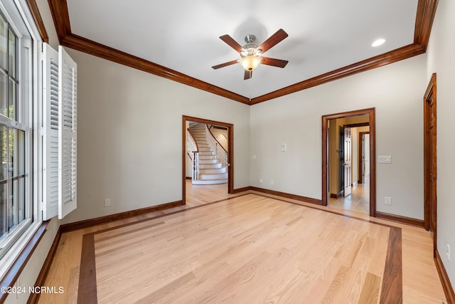 unfurnished bedroom with light hardwood / wood-style floors, crown molding, and ceiling fan