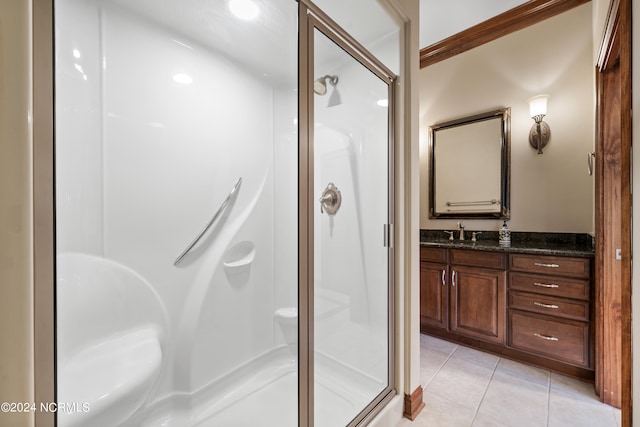 bathroom with vanity, crown molding, tile patterned floors, and an enclosed shower