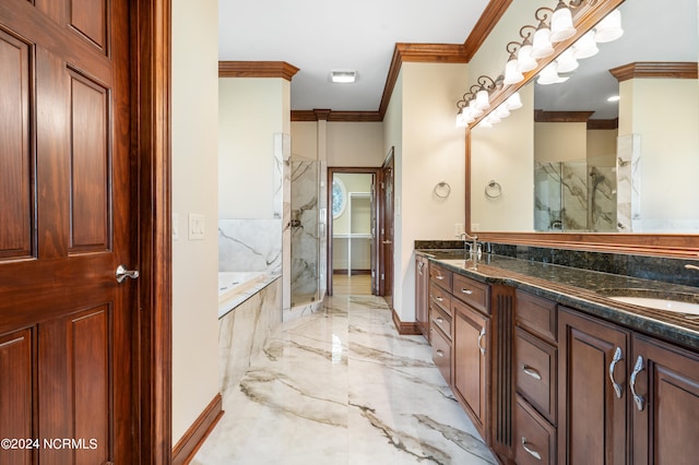 bathroom with vanity, ornamental molding, and independent shower and bath