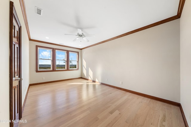 unfurnished room with ornamental molding, light hardwood / wood-style flooring, and ceiling fan