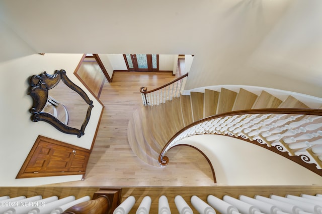 stairway featuring wood-type flooring