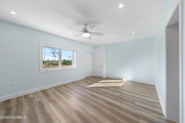 unfurnished bedroom featuring light hardwood / wood-style floors and ceiling fan