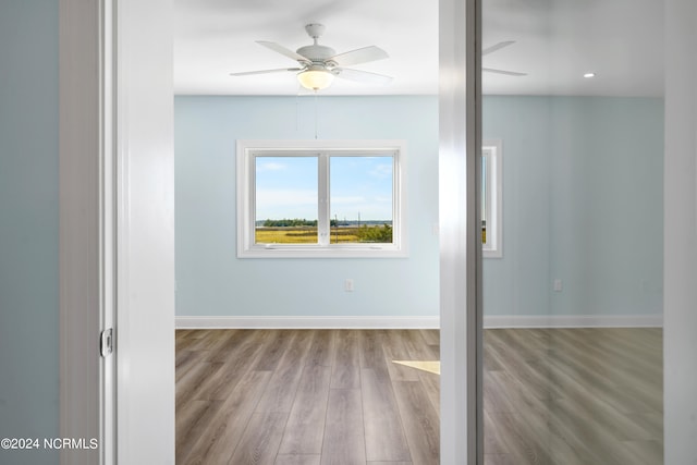 empty room featuring light hardwood / wood-style floors and ceiling fan