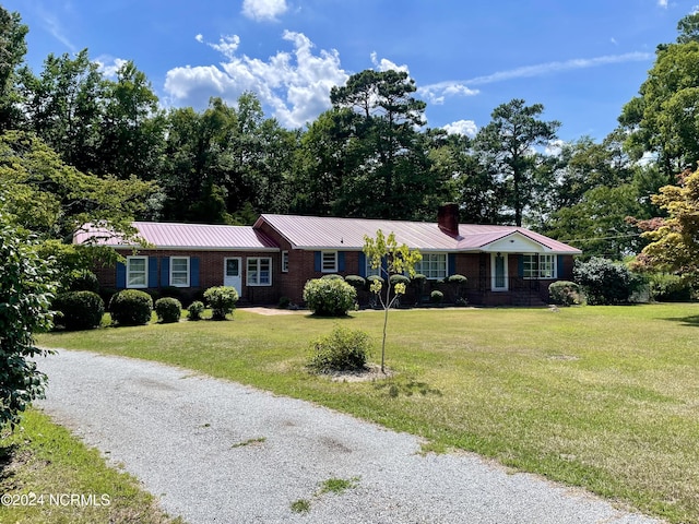 ranch-style house with a front lawn