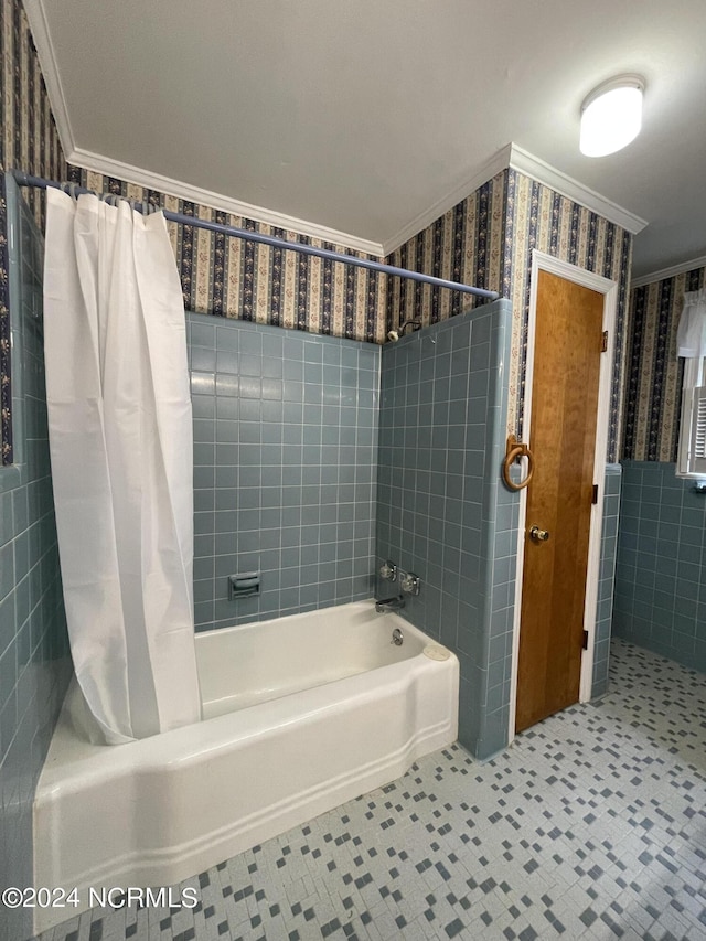 bathroom with crown molding and shower / tub combo