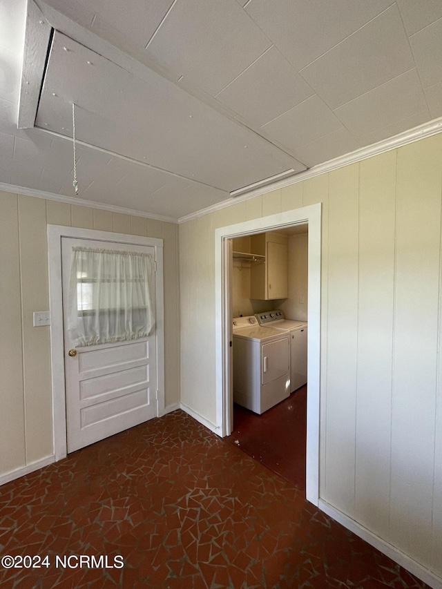 hall with crown molding and washer and clothes dryer