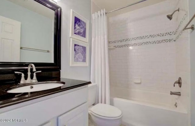 full bathroom featuring vanity, shower / bath combo, and toilet