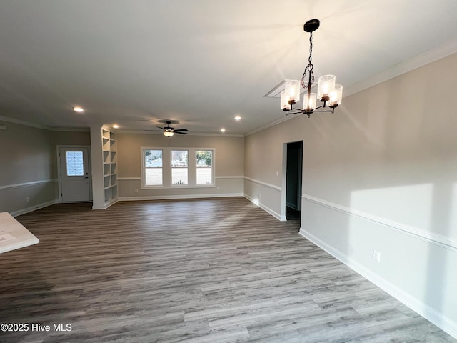 interior space with crown molding, light hardwood / wood-style flooring, and ceiling fan with notable chandelier