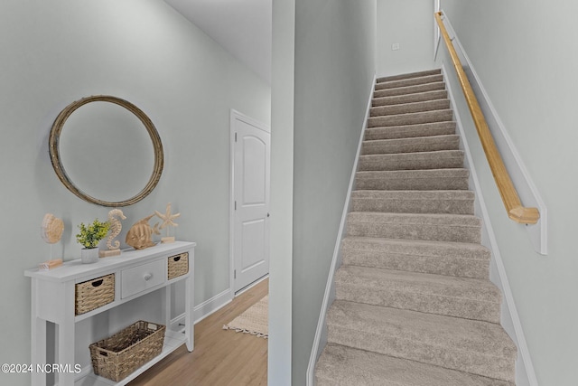 staircase featuring hardwood / wood-style flooring