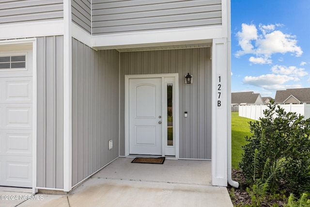 doorway to property with a garage