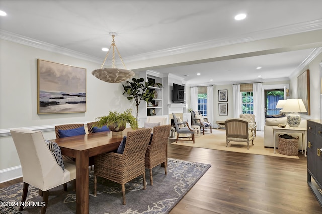 dining area featuring ornamental molding, recessed lighting, baseboards, and wood finished floors