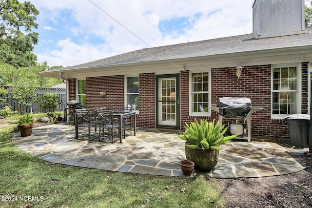 view of patio / terrace with grilling area and fence