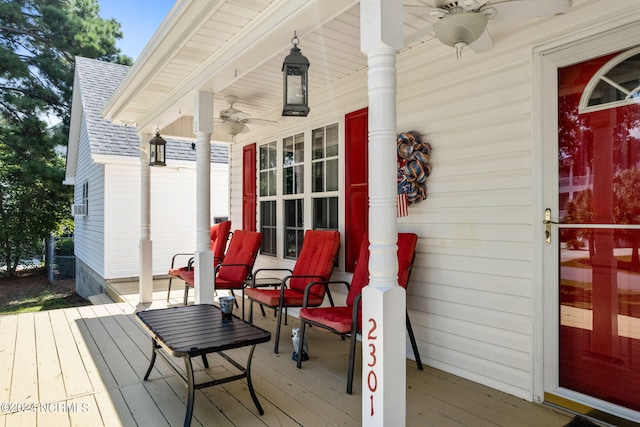 wooden terrace featuring ceiling fan