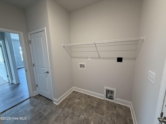 laundry area featuring washer hookup, laundry area, and baseboards