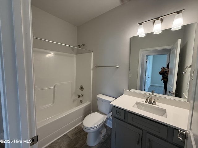 full bath with tub / shower combination, vanity, and toilet