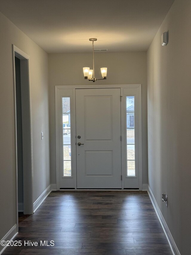 unfurnished living room with ceiling fan, a wealth of natural light, and wood-type flooring